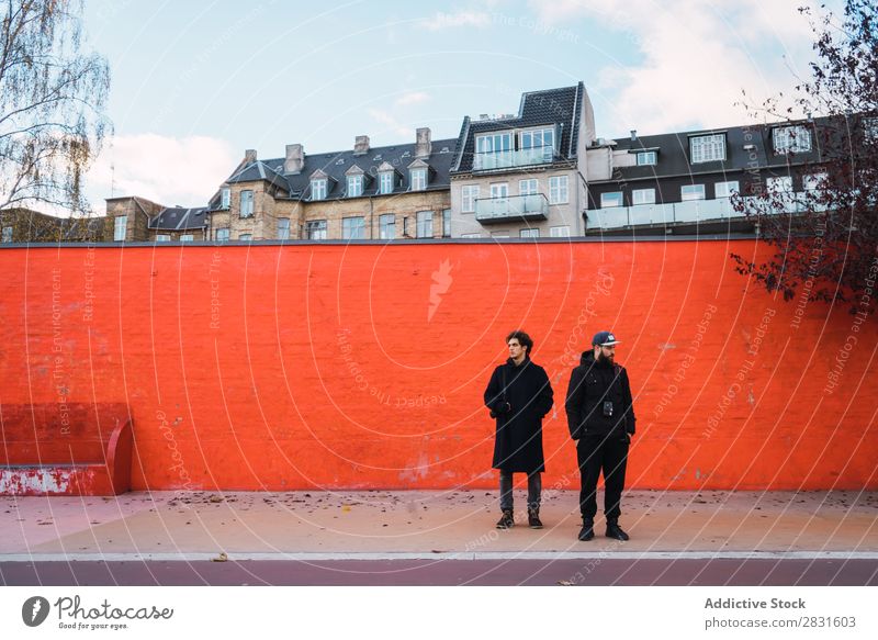 Two men at orange wall Man Stand Orange Wall (building) Together Street handsome City Youth (Young adults) Town Lifestyle Easygoing Fashion Style Adults Modern