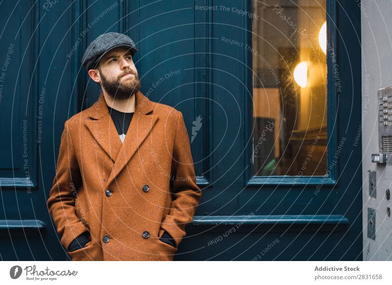 Thoughtful stylish man at door Man handsome City Style Coat Hat Cap Door Considerate Pensive Street Youth (Young adults) Town Lifestyle Easygoing Fashion Adults