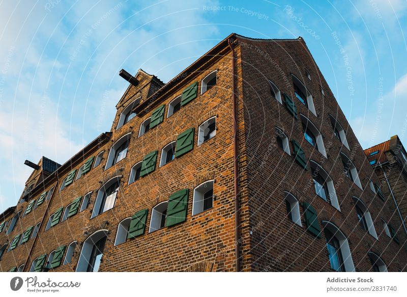 Brick building in city Building City Town Architecture Old Street House (Residential Structure) Vintage Vantage point Dark Exterior Wall (building) Sky Downtown