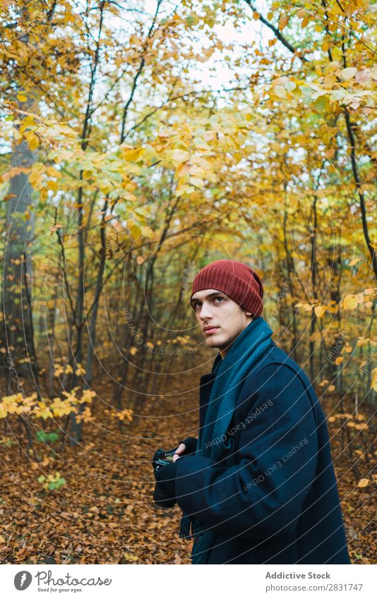 Man posing in autumnal wood Street Youth (Young adults) Town Lifestyle Easygoing Fashion Style warm clothes Adults Modern Human being Hip & trendy Guy