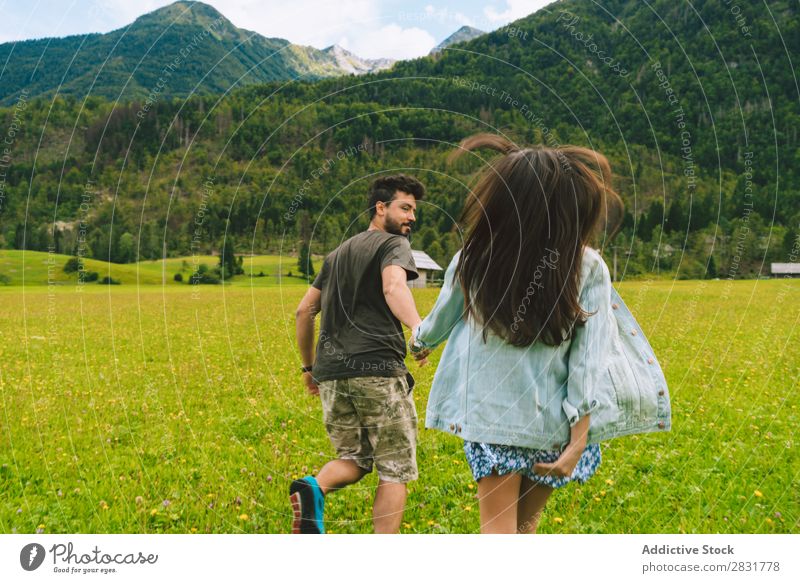 Couple running on meadow in hills Meadow Hill holding hands Nature Summer Human being Man Woman Love Grass Beautiful Together Youth (Young adults) Happy