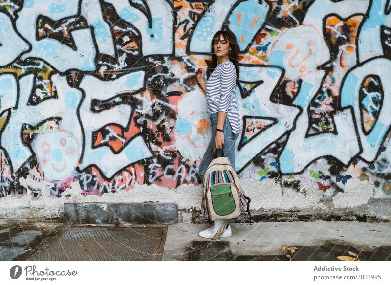 Casual girl with backpack at street Human being Easygoing Posture Self-confident Style Accessory Backpack Traveling Graffiti Youth (Young adults) Town