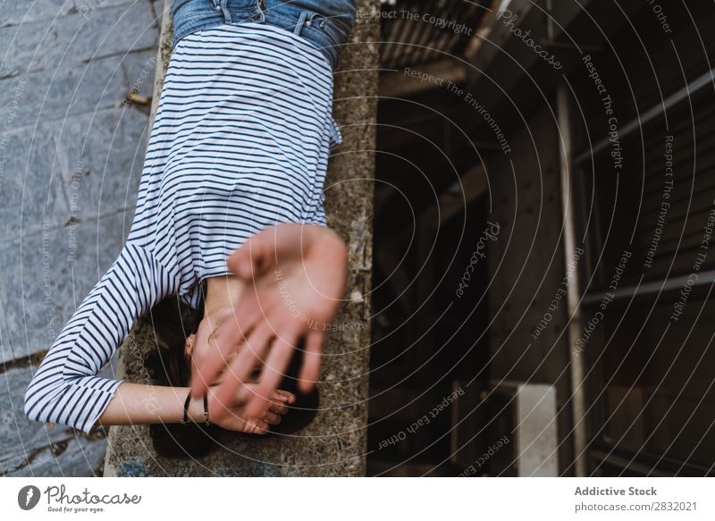 Woman covering face with hand Human being Town Playful Posture Portrait photograph Natural Street flirty Hand Playing hand up Summer City Outstretched Cheerful