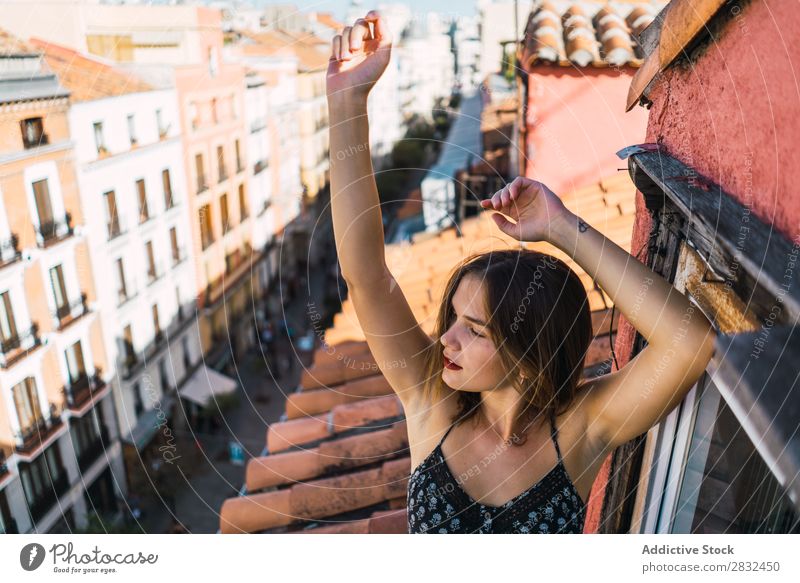 Content model grimacing on balcony Woman Cheerful romantic Happiness Grimace Skyline Balcony Terrace Posture Expression Beauty Photography Youth (Young adults)