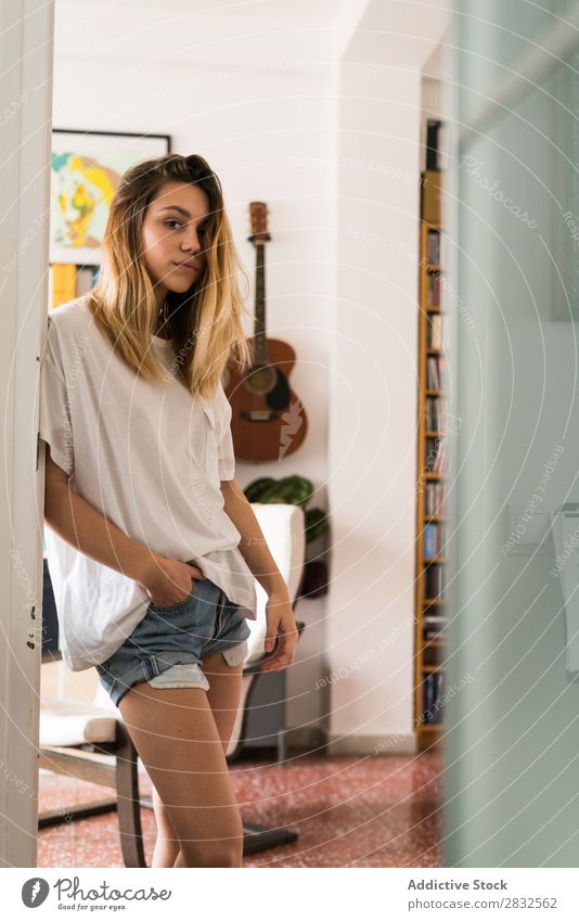 Pretty young casual woman Woman Easygoing Youth (Young adults) doorway Stand Looking into the camera Beautiful Human being Happy Attractive Girl pretty Cheerful