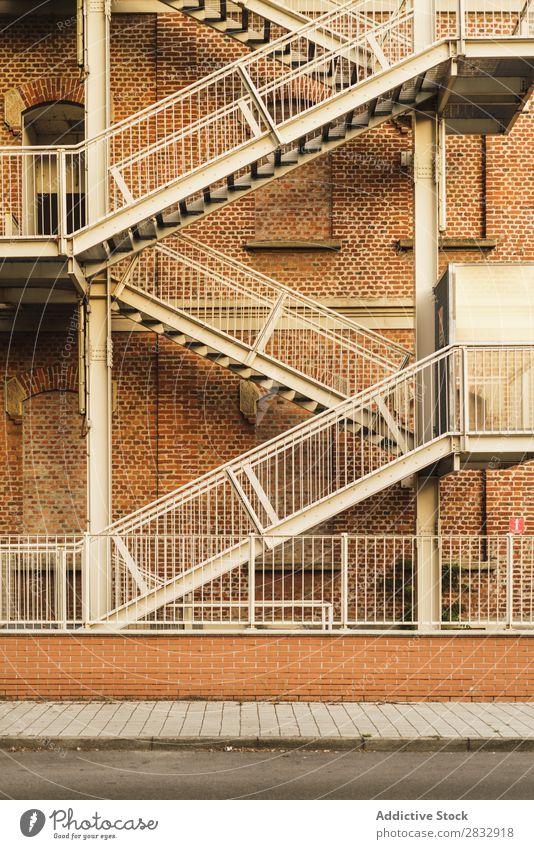 Fire stairs of building exterior Building Exterior Stairs Escape Architecture Design Emergency Structures and shapes Side Town Downtown Street Safety Brick wall