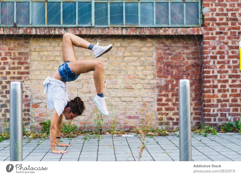 Woman in handstand at street Street Handstand Posture Balance Acrobatic Feminine Joie de vivre (Vitality) gymnastic Youth (Young adults) Expression pose
