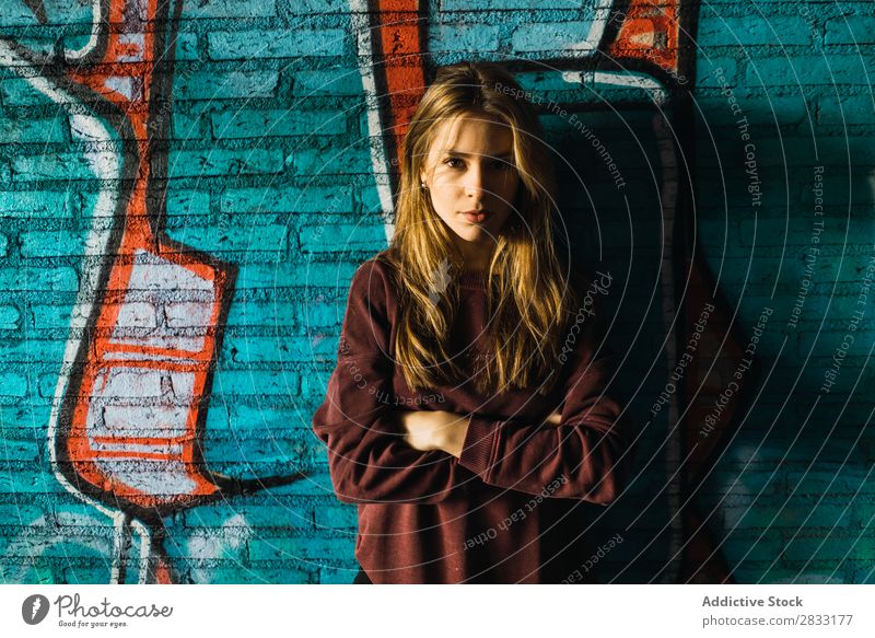 Woman at graffiti wall Wall (building) Graffiti pretty holding head Town Youth (Young adults) Beautiful Attractive Portrait photograph Human being Hip & trendy
