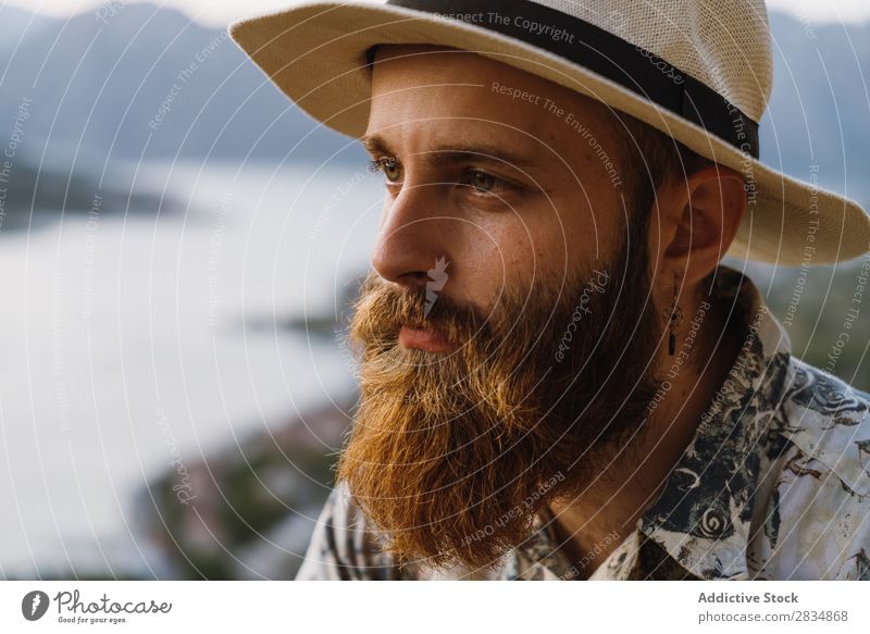 Thoughtful tourist in mountains Town Mountain River Man Human being Tourist Considerate Pensive bearded Village Vantage point pathway Landscape