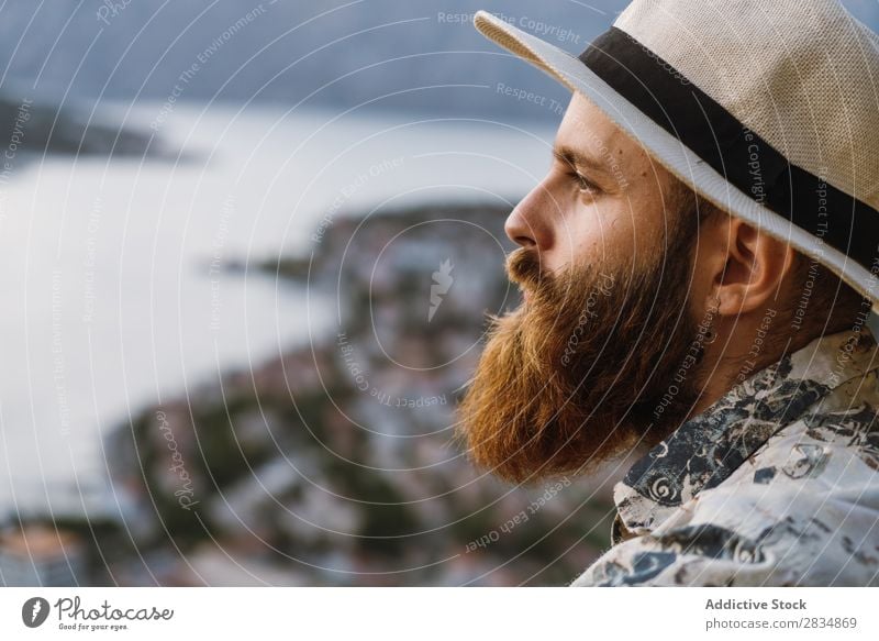 Thoughtful tourist in mountains Town Mountain River Man Human being Tourist Considerate Pensive bearded Village Vantage point pathway Landscape