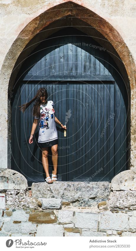 Woman posing at big door Door Vintage Posture Wood Handle Youth (Young adults) Girl Human being Beauty Photography Portrait photograph Beautiful pretty Model