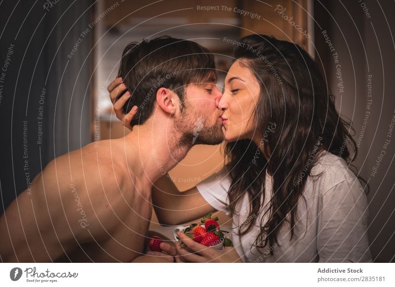 A couple kissing with strawberry Couple Youth (Young adults) Kissing Strawberry Woman Man Love Relationship eyes closed Berries Red Juicy Fruit Human being 2