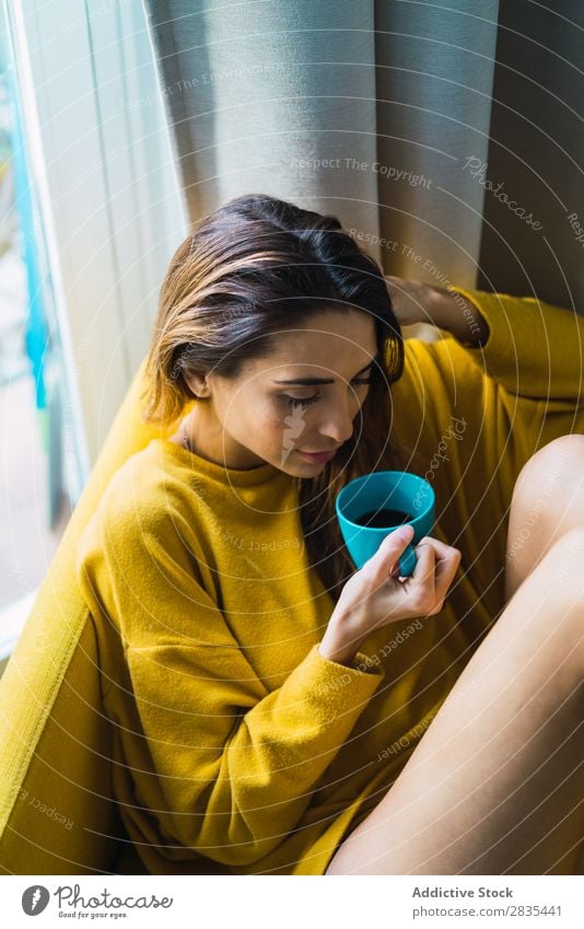 Dreamy woman with cup Woman pretty Home Youth (Young adults) Posture Pensive holding head Cup Hot Drinking Relaxation Considerate Portrait photograph Beautiful