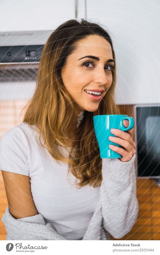 Woman having hot drink on kitchen pretty Home Youth (Young adults) Coffee Cup Drinking Sit brewed Posture Portrait photograph Beautiful Lifestyle