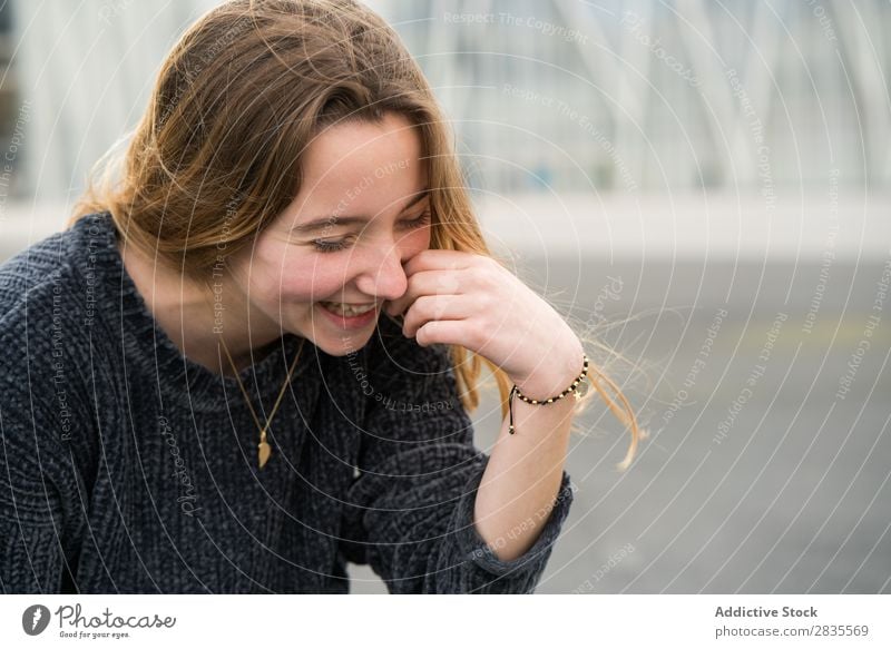 Happy laughing young girl Woman pretty Portrait photograph Laughter Youth (Young adults) Beautiful Looking into the camera Touch Cheek Cheerful Smiling Sweater