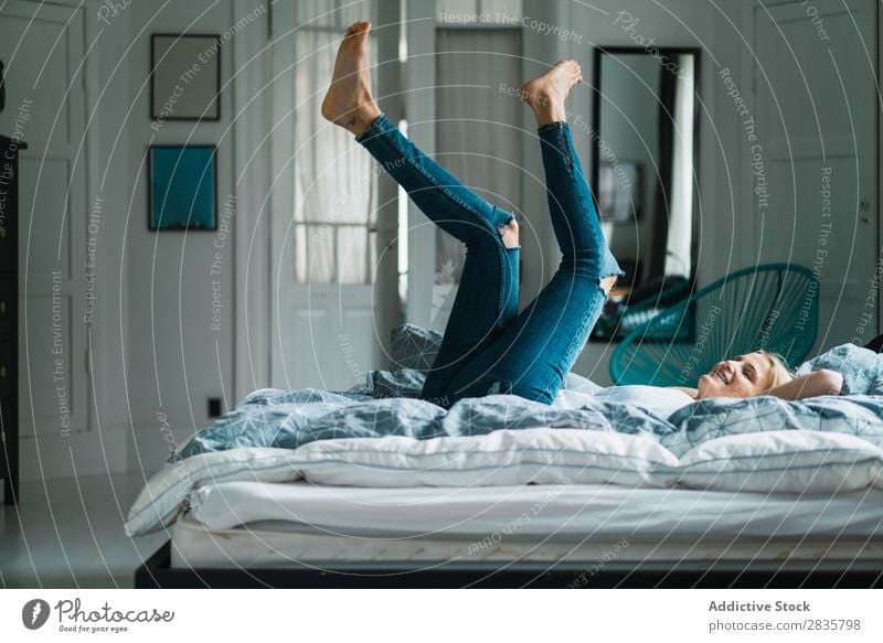 Woman lying with legs up pretty Home Youth (Young adults) Blonde Beautiful falling Lie (Untruth) Lifestyle Beauty Photography Attractive Portrait photograph