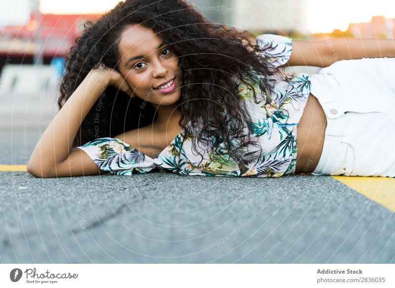 Woman lying on road pretty Youth (Young adults) Portrait photograph Lie (Untruth) Street Pavement Asphalt Looking into the camera Black African City Town Head