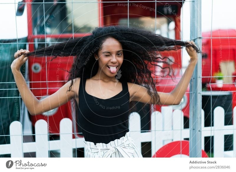 Playful woman winking Woman pretty Youth (Young adults) Portrait photograph tongue out making faces grimacing Looking into the camera Black African City Town