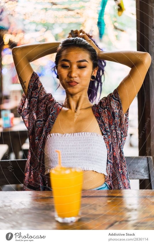 Asian woman setting hair in cafe Woman pretty Youth (Young adults) Beautiful Portrait photograph Café Hair Set Juice Purple asian eastern Fashion Attractive