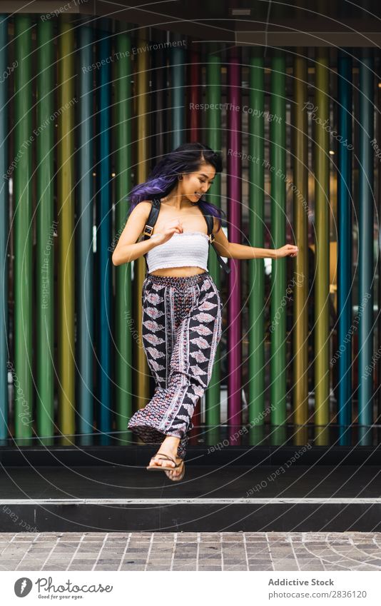 Young woman posing on colorful columns Woman pretty Street Youth (Young adults) Beautiful Column Multicoloured Portrait photograph Hair Purple asian eastern