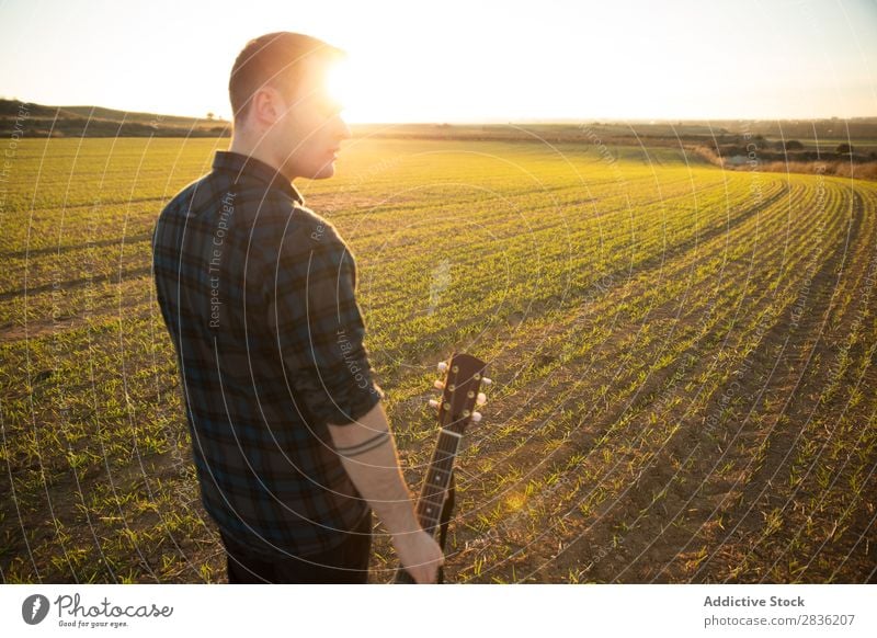 Man with guitar on field Guitar Nature Music Stand Lifestyle Musician Easygoing Guitarist Acoustic Field Green Walking Musical Human being Guy Natural