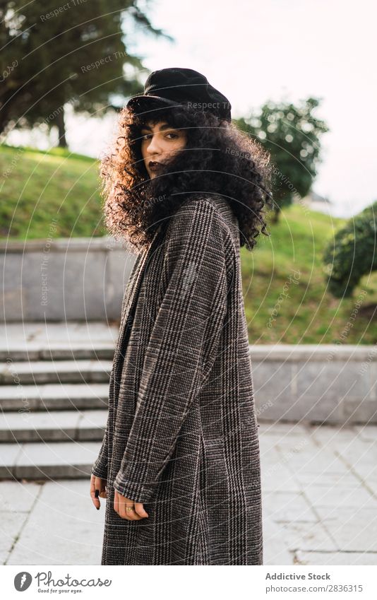 Pretty stylish woman in park Woman Attractive City fashionable Curly Brunette Park Green Coat Hat Fashion Youth (Young adults) Beautiful pretty Street Model