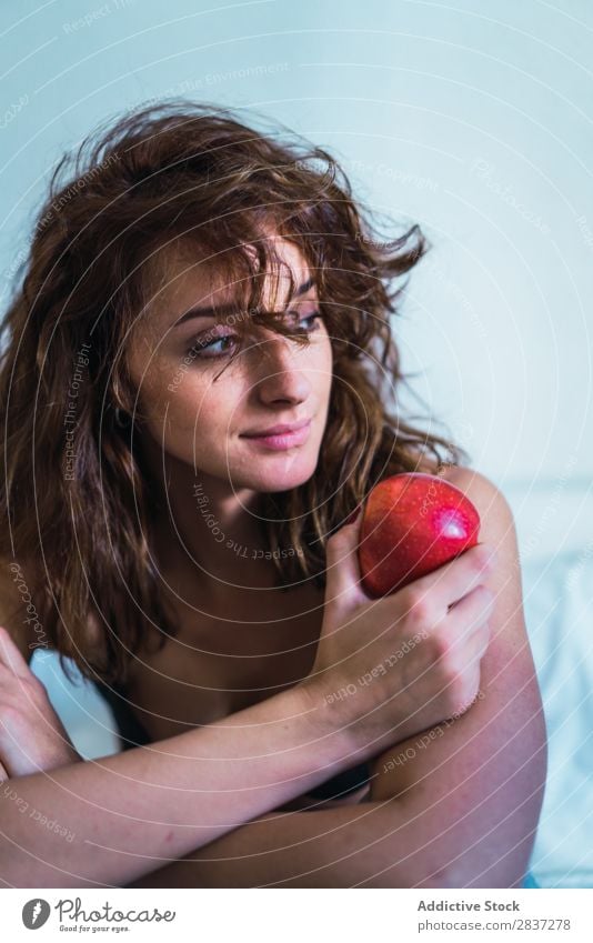 Attractive woman with apple Woman Home pretty Apple Food Dream Pensive Youth (Young adults) Posture Relaxation Portrait photograph Beautiful Lifestyle