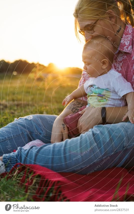 Woman with child on lawn Mother Child Park Lawn Green Sunbeam Happy Human being Happiness Summer Lifestyle Love same gender parents Homosexual Couple
