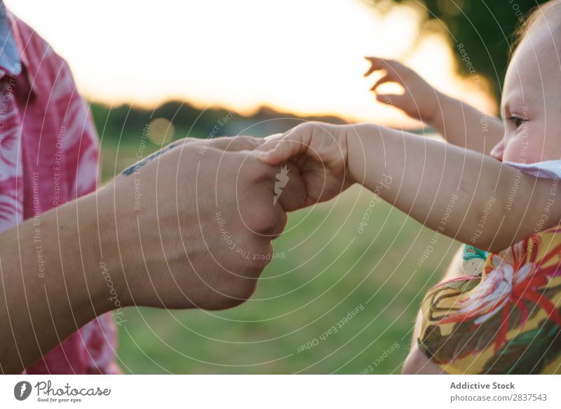 Mother and child holding hands Child Park Lawn Green Sunbeam Family & Relations Happy Human being Woman Happiness Summer Lifestyle Love Parents Nature