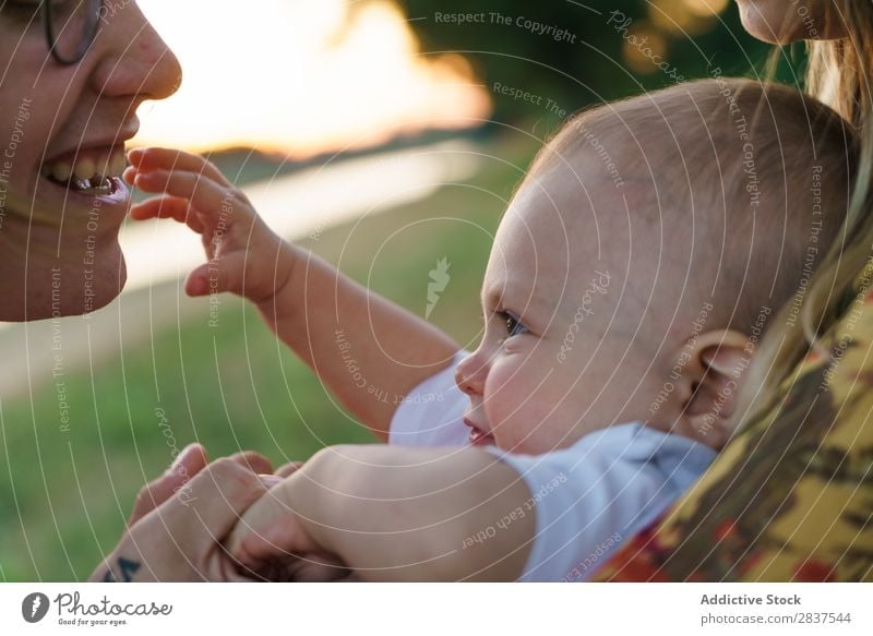 Mother and child having fun Child Park Lawn Green Sunbeam Family & Relations Happy Human being Woman Happiness Summer Lifestyle Love Parents Nature
