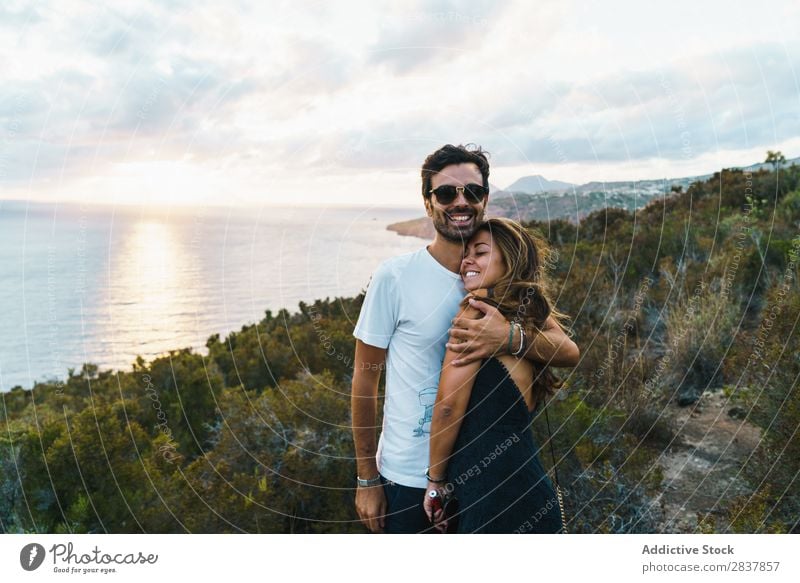 Cheerful couple posing on nature Couple Landscape Posture Ocean embracing Tourist Adventure Nature Panorama (Format) Freedom Relaxation Together Traveling