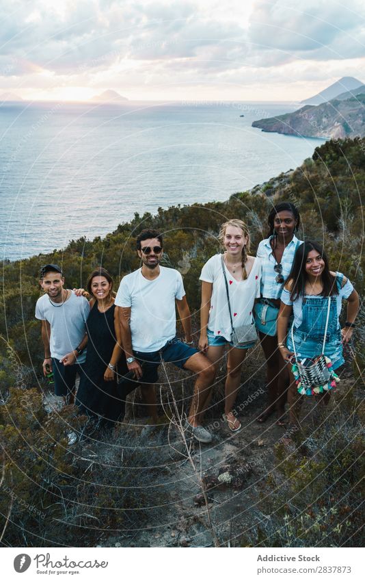 Group of people standing on cliff Human being Tourism Landscape Freedom Action Ocean Adventure Summer Exterior shot Vacation & Travel Tourist multiethnic Black
