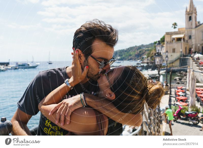 Kissing couple in sunny city Couple Traveling City Street romantic Exterior shot Vacation & Travel loving Expression Together Summer Trip embracing Skyline