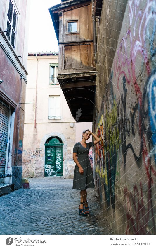 Smiling woman in alley Woman Alley Graffiti Wall (building) pretty Street Lifestyle Cheerful Calm Relaxation Blonde Walking Lovely Attractive Lady City