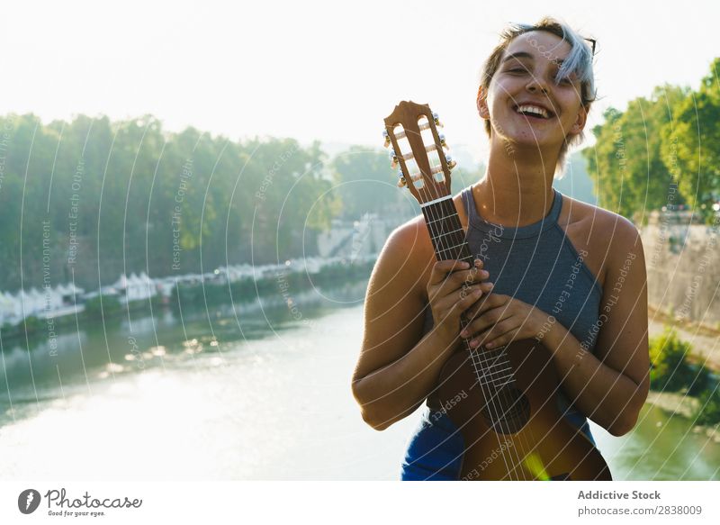 Girl posing with small guitar at street Woman Street Entertainment Ukulele Musician City Lifestyle Style Summer Leisure and hobbies Beauty Photography