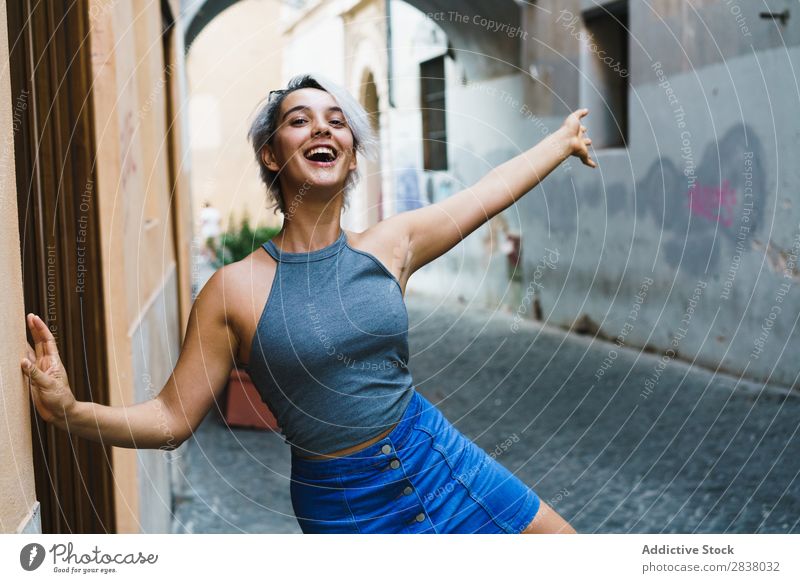 Laughing girl at street Woman Posture romantic Vacation & Travel Laughter Style Youth (Young adults) Town Cheerful Expression traveler Hair and hairstyles