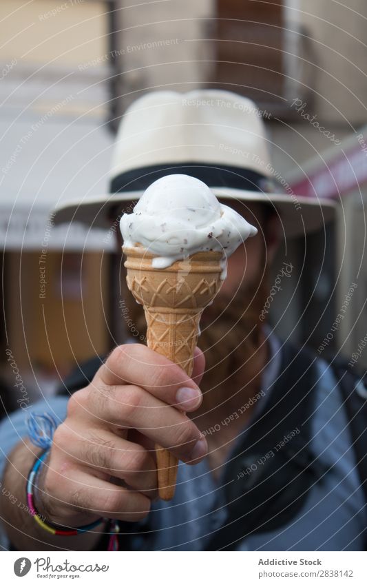 Man covering face with ice-cream Joy Posture obsession human face traveler Snack Youth (Young adults) Easygoing Leisure and hobbies Expression Emotions Dessert