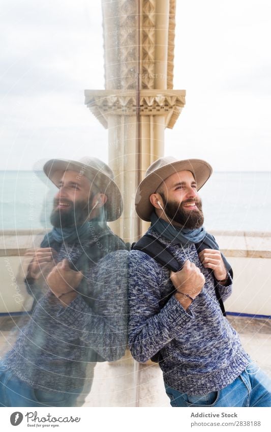 Cheerful bearded man with headphones Man Headphones Style Looking away Smiling Vacation & Travel Tourist Happy Portrait photograph Stand Music