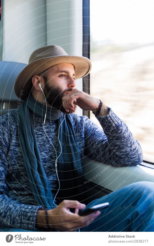 Man listening music in train Railroad Music Listening Vacation & Travel Youth (Young adults) Looking away Headphones Beard Transport Sit Passenger Modern