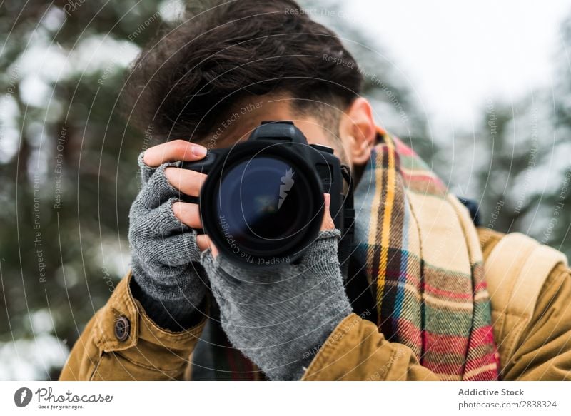 Male photographer taking shot Man Winter Photographer Equipment Photography Relaxation Shot Lens photocamera Leisure and hobbies Photo shoot