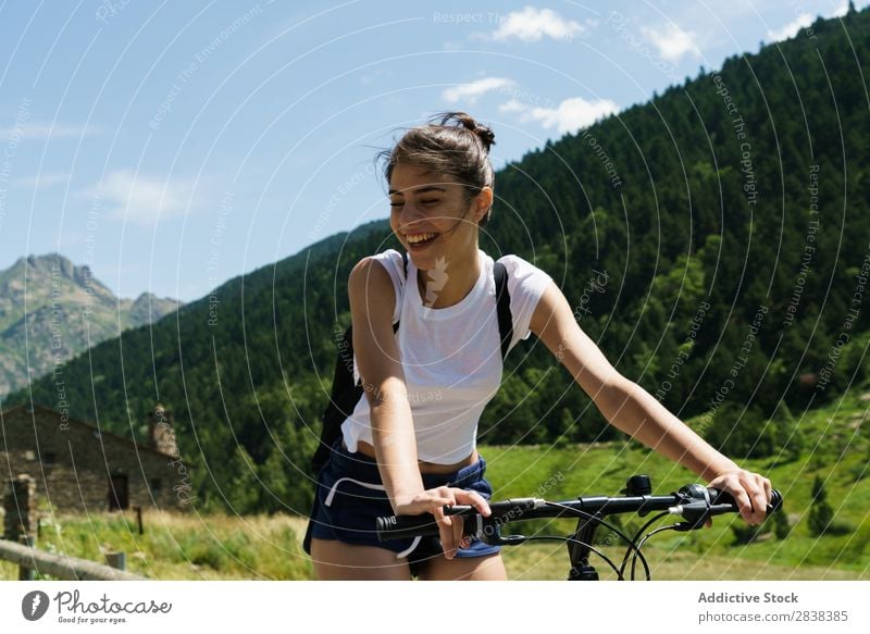 Woman riding bike Athletic Bicycle Cheerful Smiling Sports Cycle Girl Action Lifestyle Cycling Human being workout Mountain Motorcycling Relaxation Asphalt