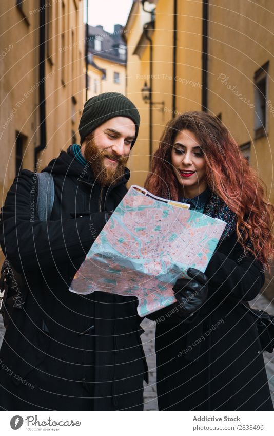 Couple with map on street Street Happy City Human being Map Navigation Vacation & Travel Tourism Love Happiness Relationship Cheerful Youth (Young adults) Man