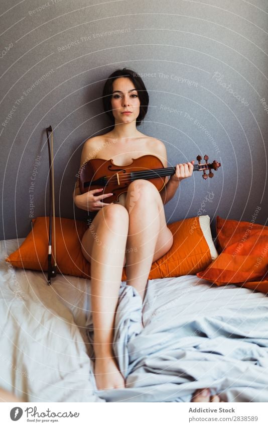 Naked woman posing with violin Woman Violin Eroticism To enjoy Musician Covering sexual Bed Breasts Home Playing instrument Alluring Harmonious Feminine