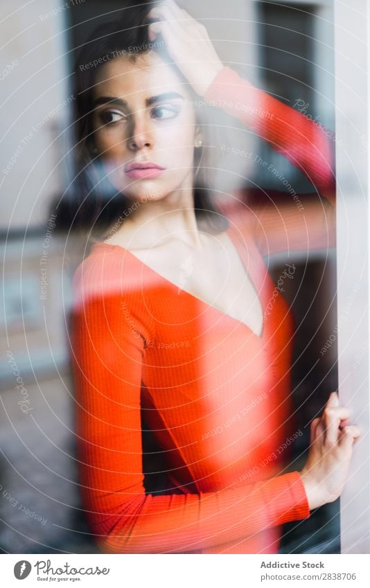 Pretty woman leaning on window Woman Home pretty Window Lean Orange Dress Youth (Young adults) Posture Relaxation Portrait photograph Beautiful Lifestyle