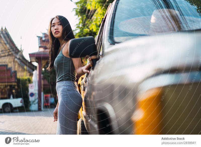 Asian woman leaning on car Youth (Young adults) Lifestyle Beautiful Girl Happiness Caucasian Vacation & Travel Adults Vehicle Car Woman Free peacefulness Lean