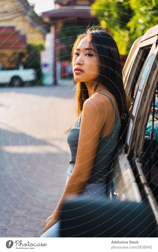 Asian woman leaning on car Youth (Young adults) Lifestyle Beautiful Girl Happiness Caucasian Vacation & Travel Adults Vehicle Car Woman Free peacefulness Lean