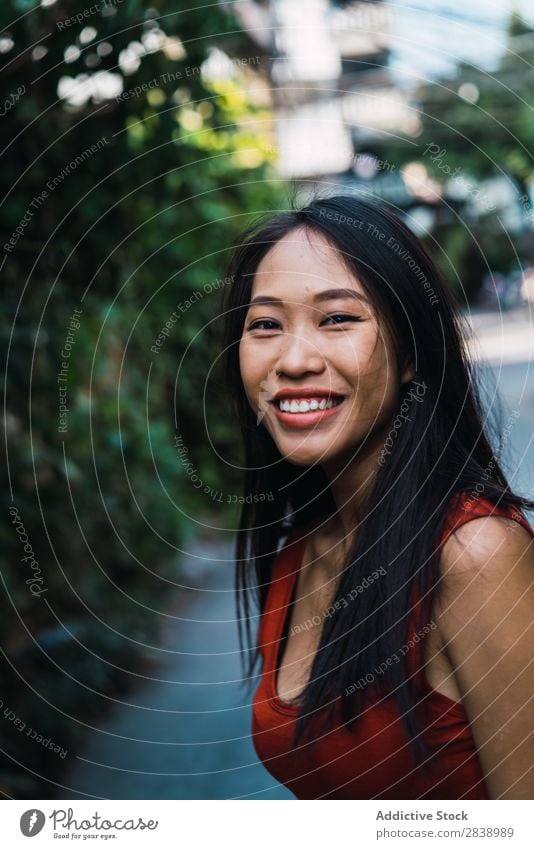 Cheerful woman on narrow street Woman pretty asian Youth (Young adults) Smiling Happy Joy Street Green Town Narrow Beautiful Portrait photograph Attractive
