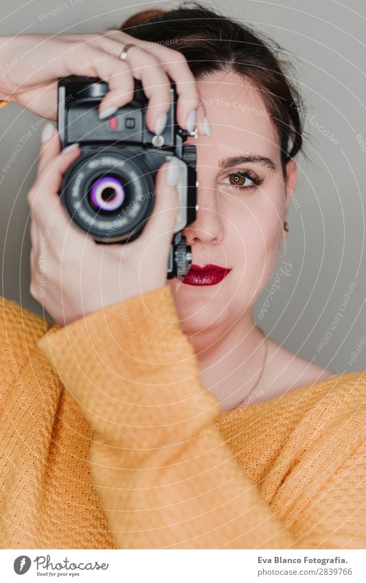 close up portrait of a young woman holding a camera Lifestyle Happy Beautiful Face Leisure and hobbies Work and employment Camera Human being Woman Adults Art