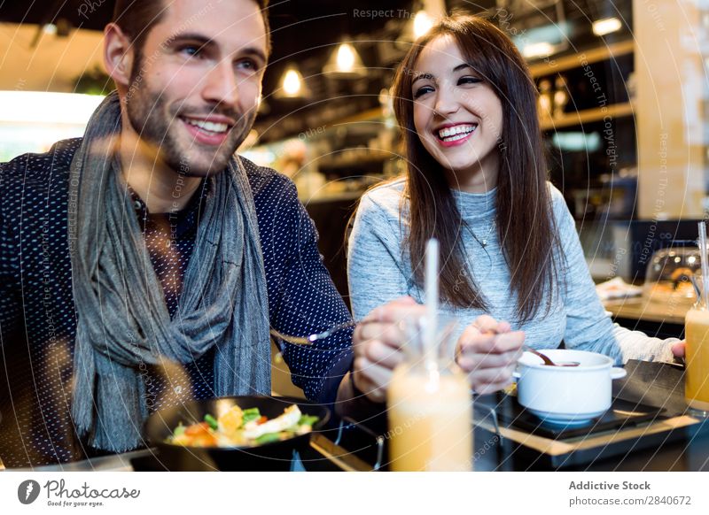 Beautiful young couple eating in restaurant. Eating Dinner Date Lunch Food Woman Meal Latin Easygoing customers Youth (Young adults) Friendship Cute Gorgeous