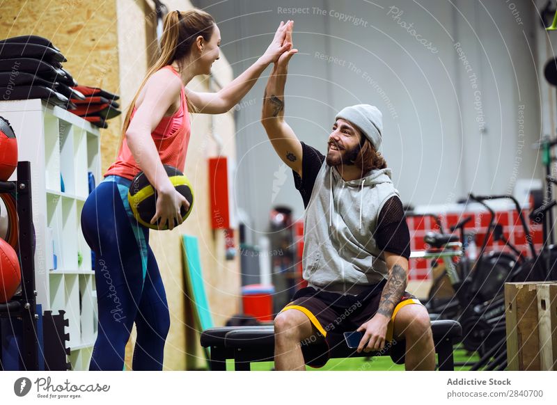 Sporty people cheering themselves in gym Human being Gymnasium workout Athletic Fitness Practice Lifestyle high five Applause Sports Healthy Sportswear Action